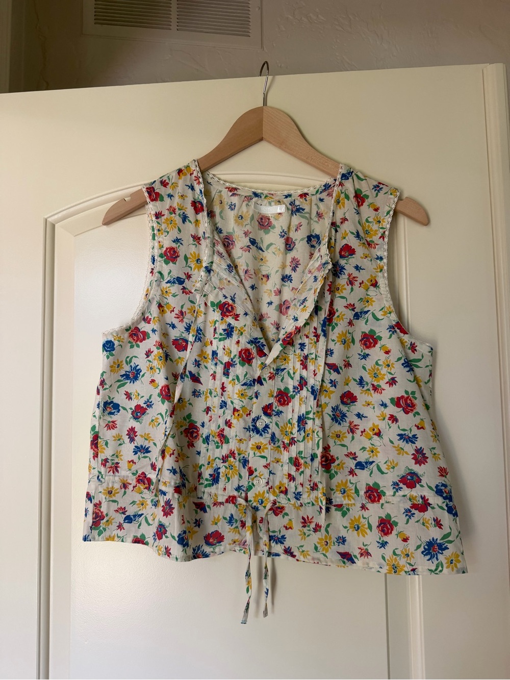 Women's Floral Sleeveless V-Neck Top - White with Multi-Color Bloom